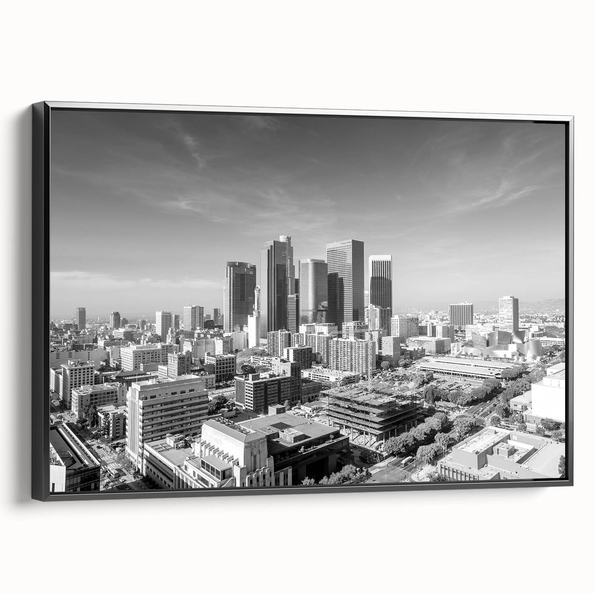 Black and white wall art featuring a vintage poster of a mountainous landscape, ideal for bedroom ambiance.