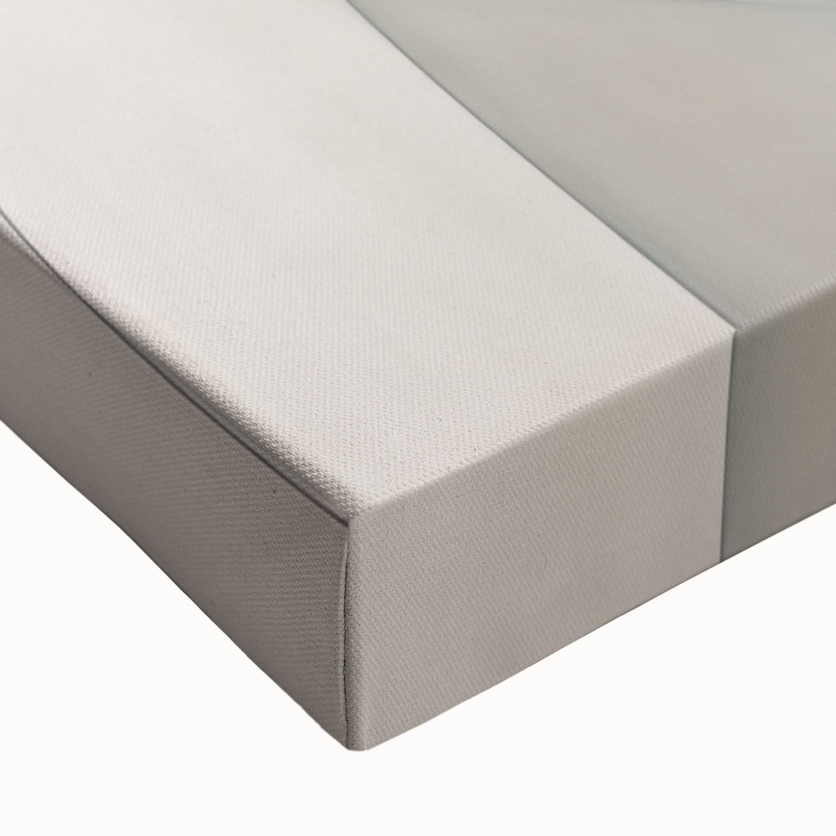 Close-up of a stretched canvas depicting an abstract minimalist design in soft pastel colors, showcasing fluid shapes and textures ideal for modern home decor.