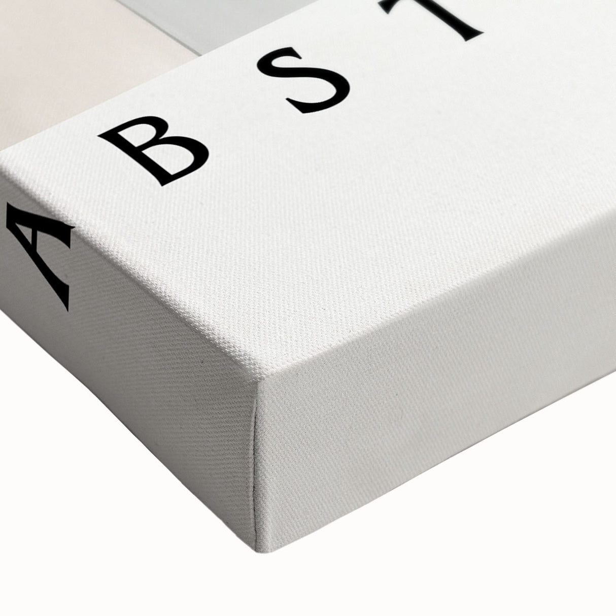 Close-up of a stretched canvas showcasing an abstract minimalist wall art design with soft earth tones, ideal for modern home decor. This elegant piece adds a contemporary touch to any interior space.