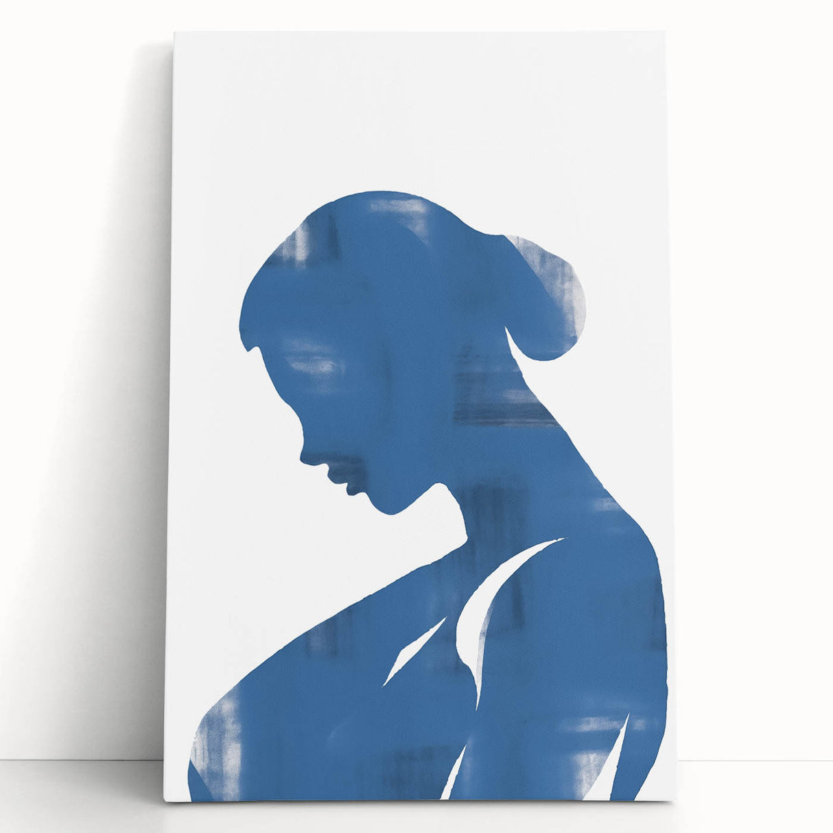 Abstract minimalist wall art design showcasing fluid shapes in soft pastel colors, elegantly stretched on canvas and leaning against a wall.