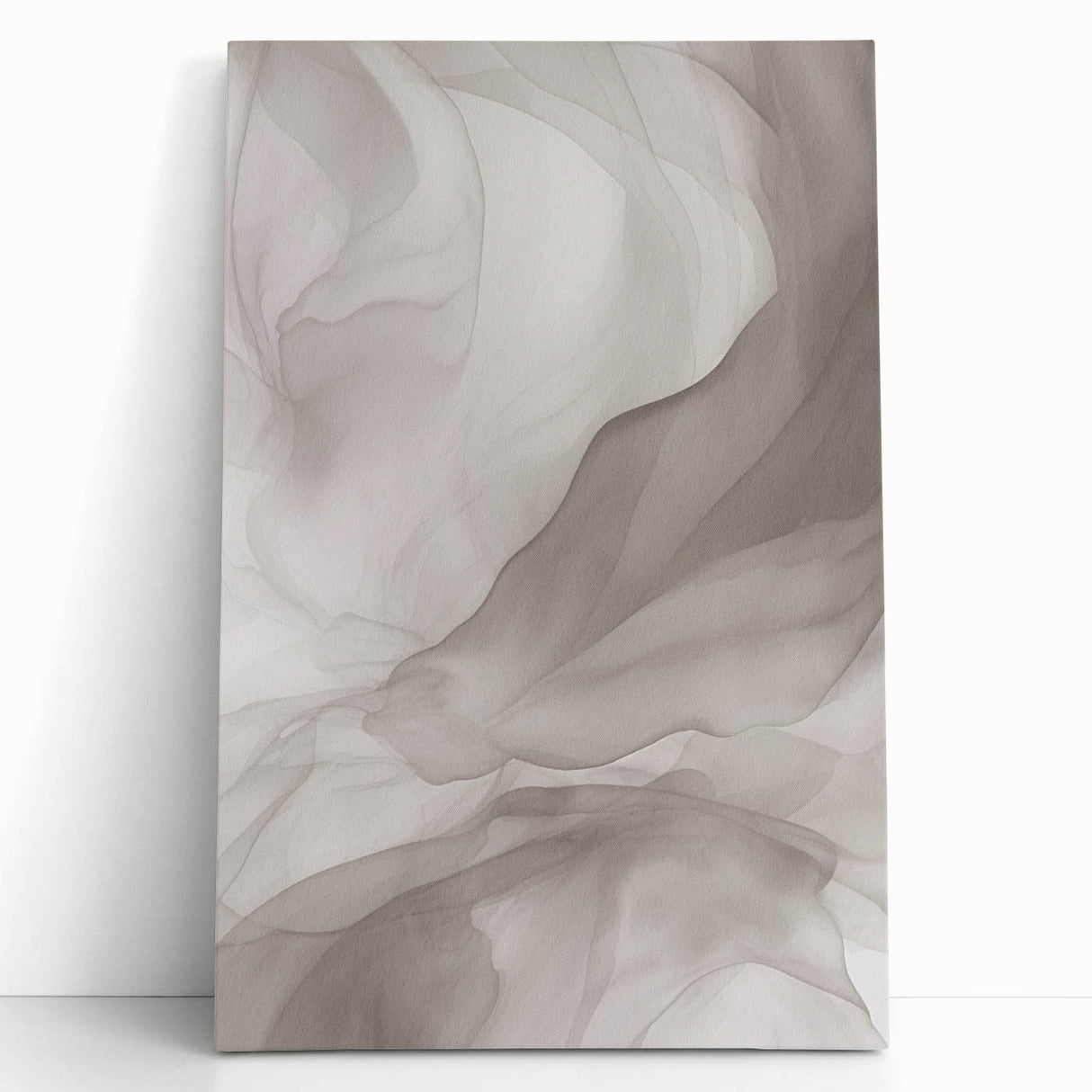 Abstract modern wall art collection showcasing vibrant colors and geometric patterns on stretched canvas, elegantly leaning against a neutral wall.