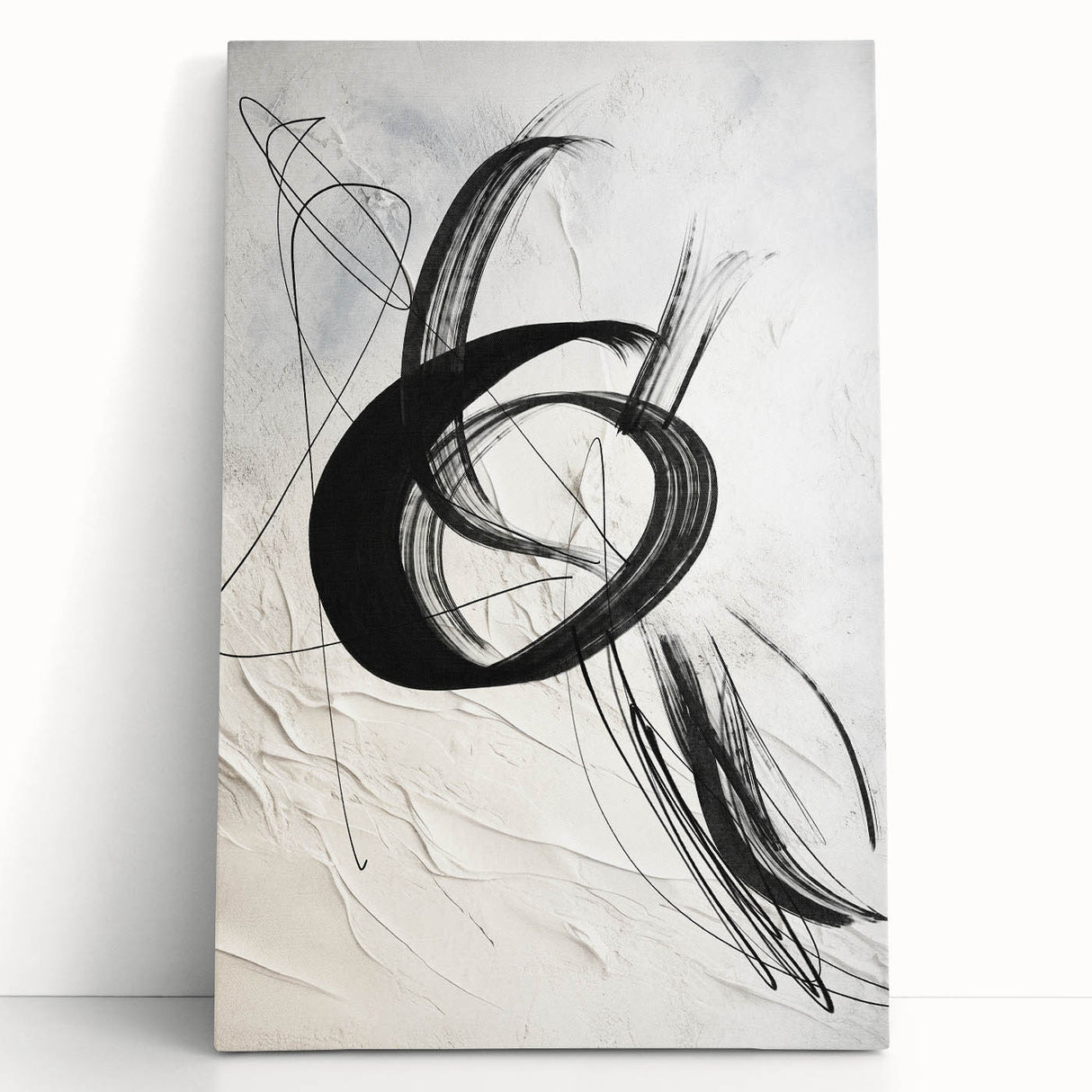 Abstract modern wall art collection featuring vibrant colors and geometric shapes on stretched canvas, leaning against a neutral wall, ideal for contemporary home decor.