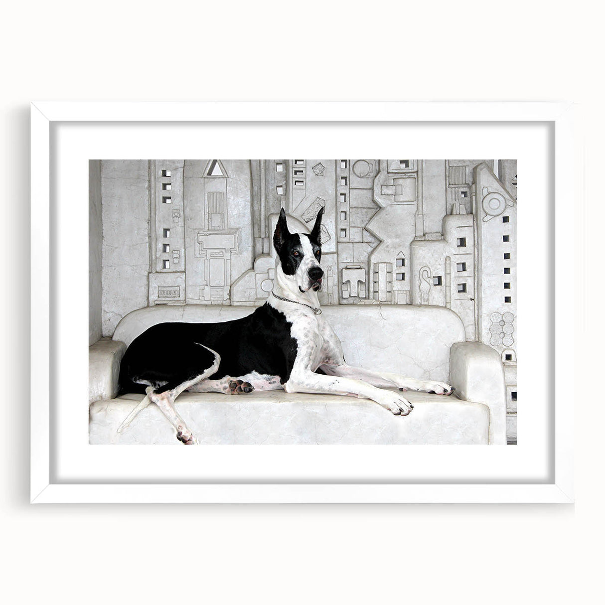 Framed wall art featuring a vibrant design of various dog breeds, set in a sleek white frame with a mat. Perfect for animal lovers and home decor enthusiasts.