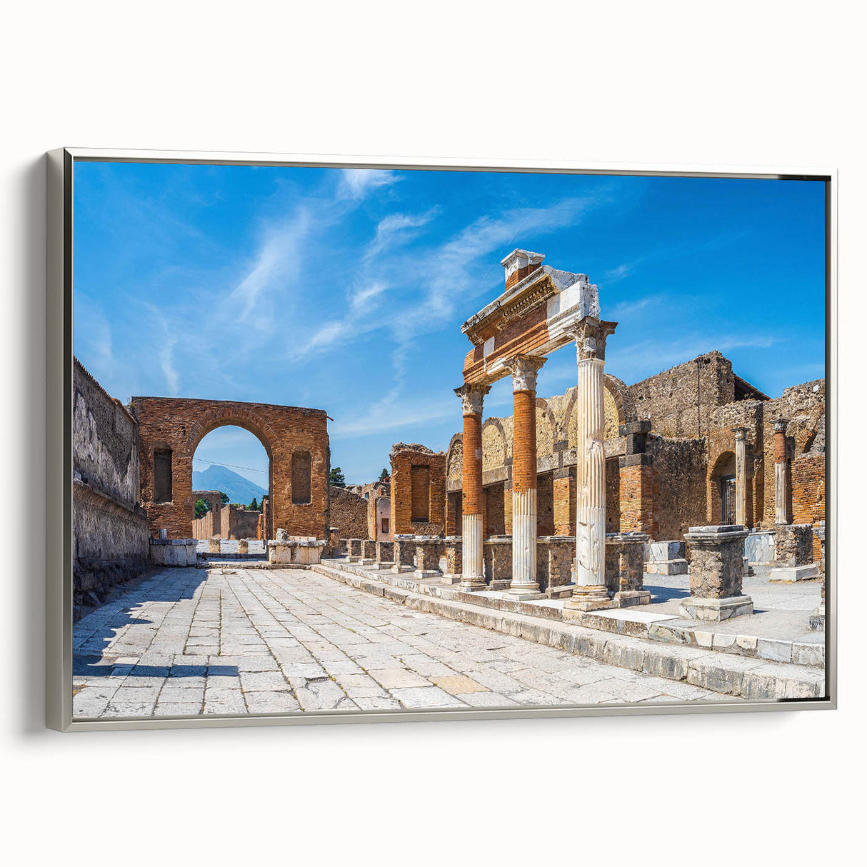 Framed canvas featuring a vintage poster of ancient ruins in muted earth tones.