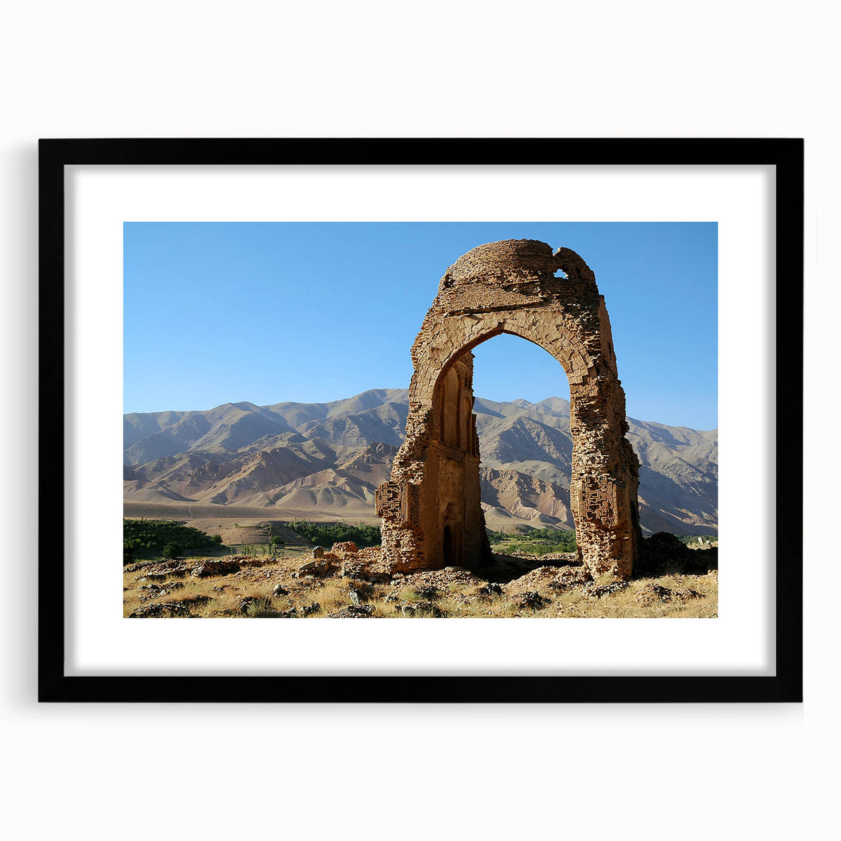 Colorful abstract art print featuring textured ancient ruins, in a black frame with mat, ideal for living room decor.