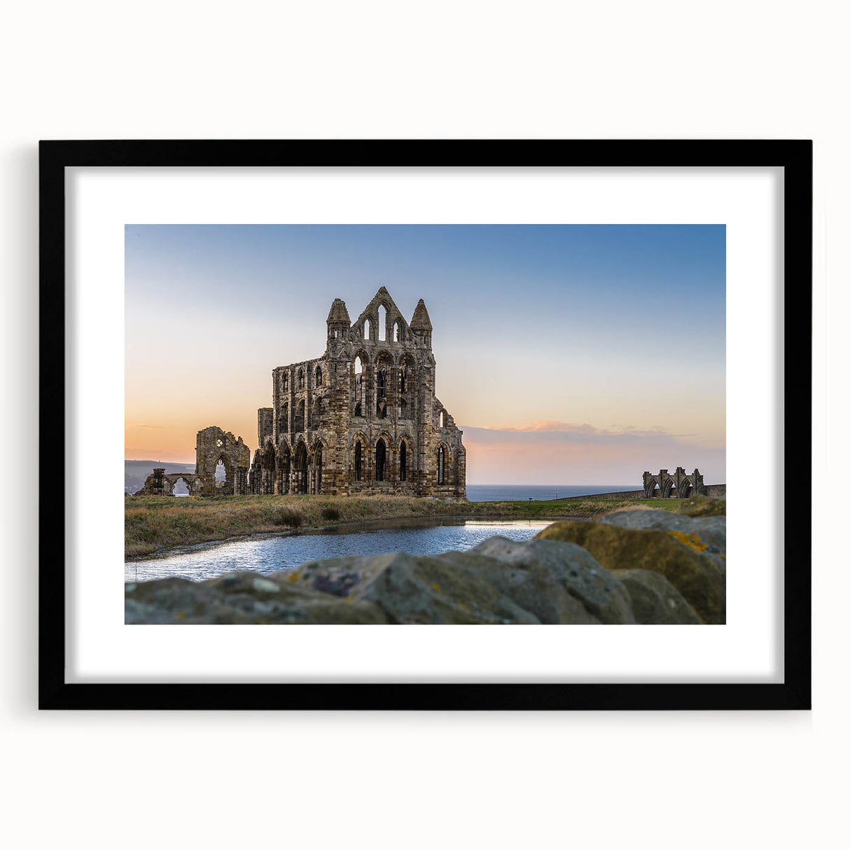 Extra large abstract art print of colorful, textured ancient ruins on a black framed canvas, ideal for living room decor.