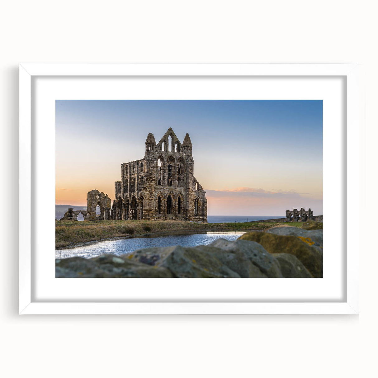 Abstract art print of ancient ruins in muted earth tones on a framed white canvas, suitable for dining room decor.