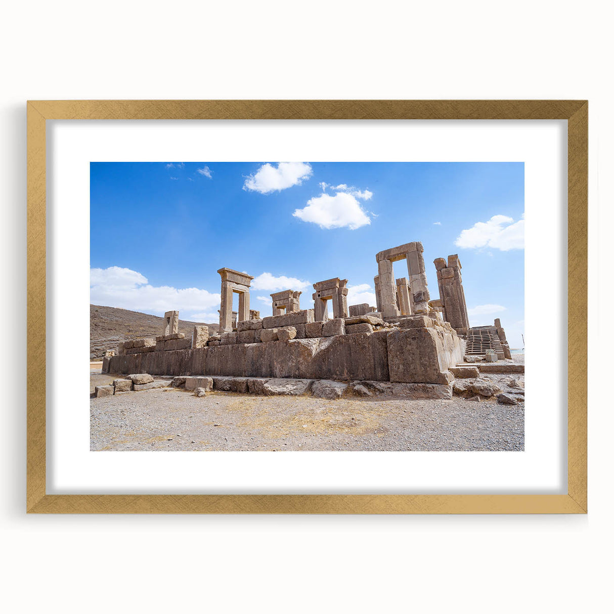 Extra large wall art featuring abstract textured design of ancient ruins in muted earth tones, framed in gold.