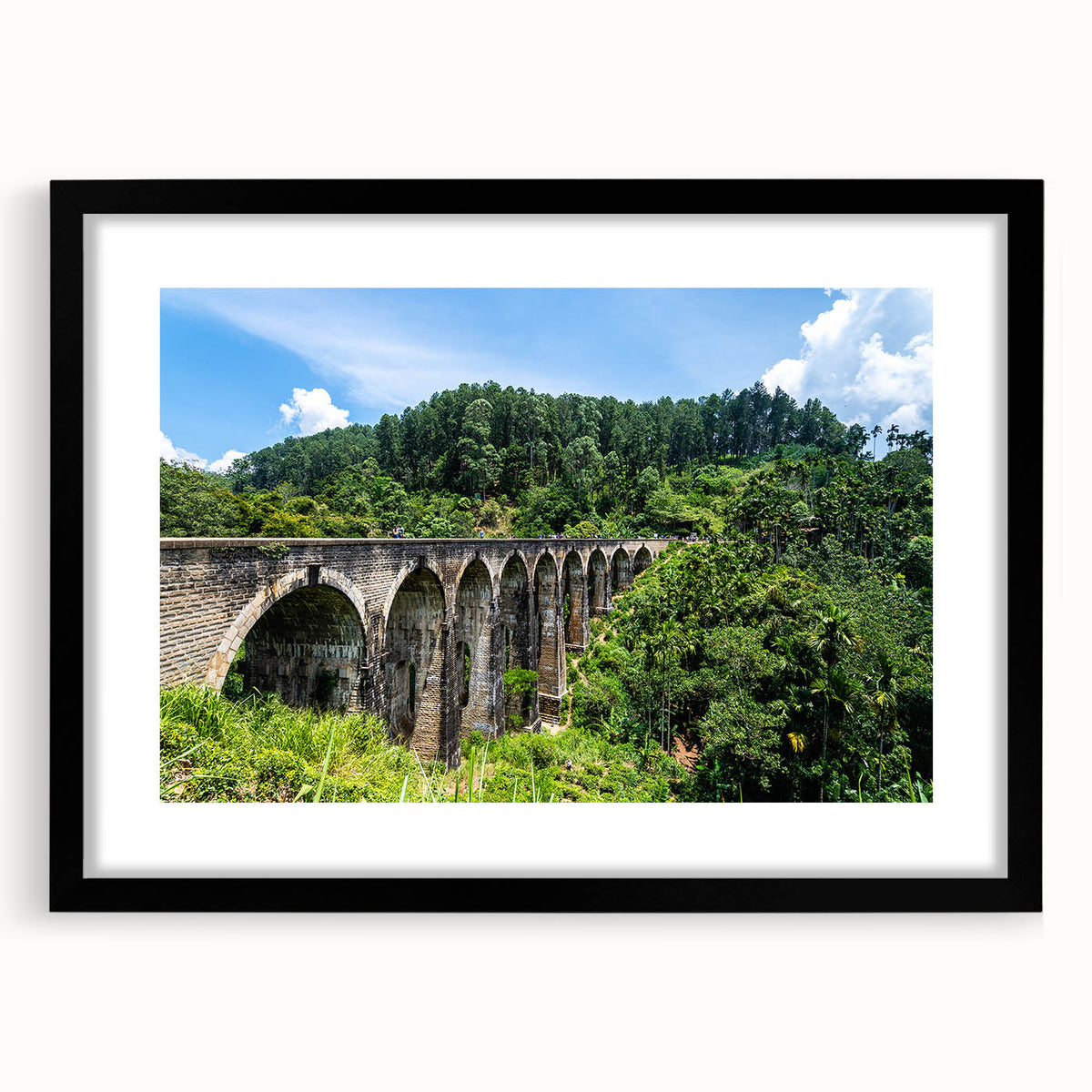 Extra large abstract art print featuring colorful, textured arches on a black framed canvas, ideal for living room decor.