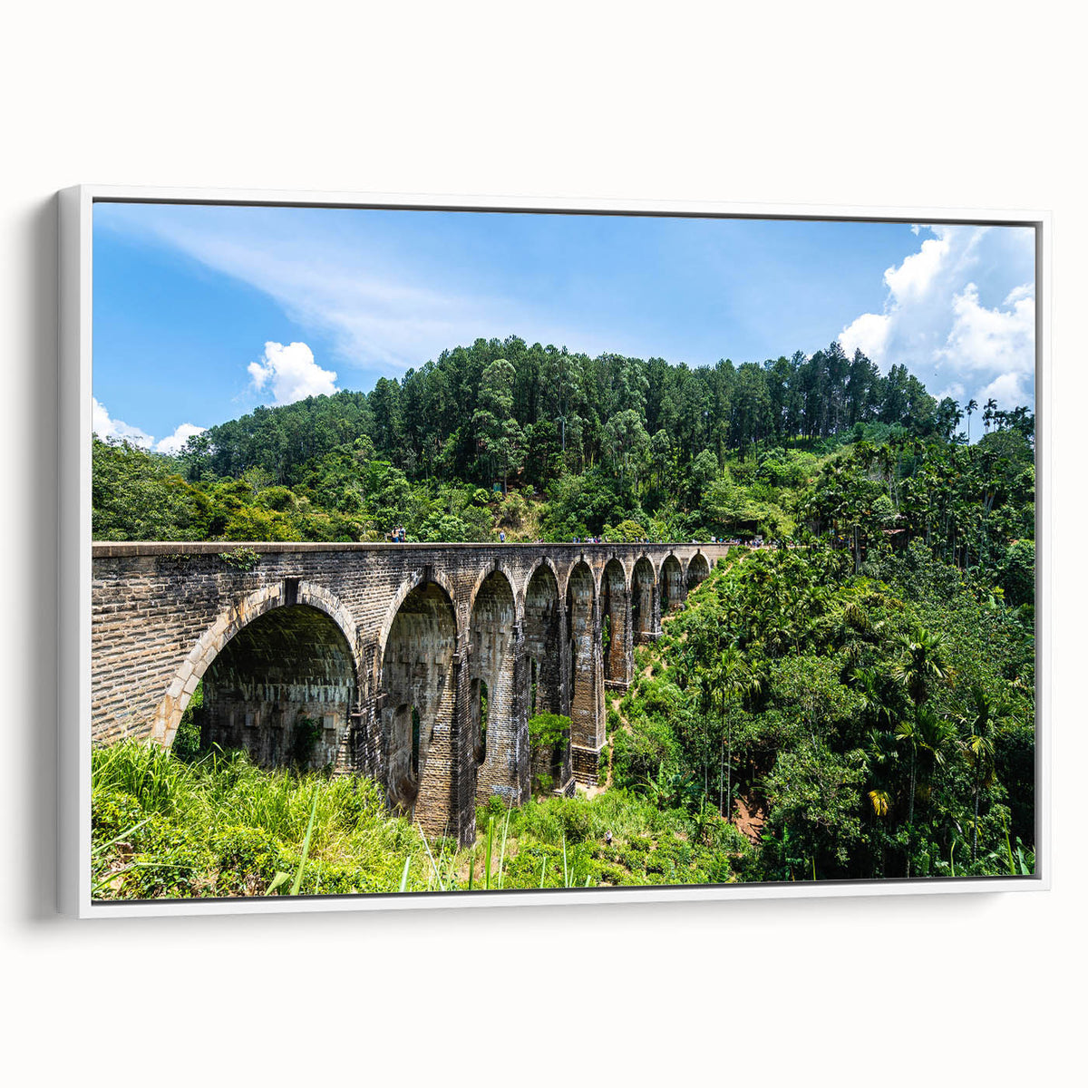Framed canvas featuring a black and white vintage poster of landscape art paintings with colorful art accents.