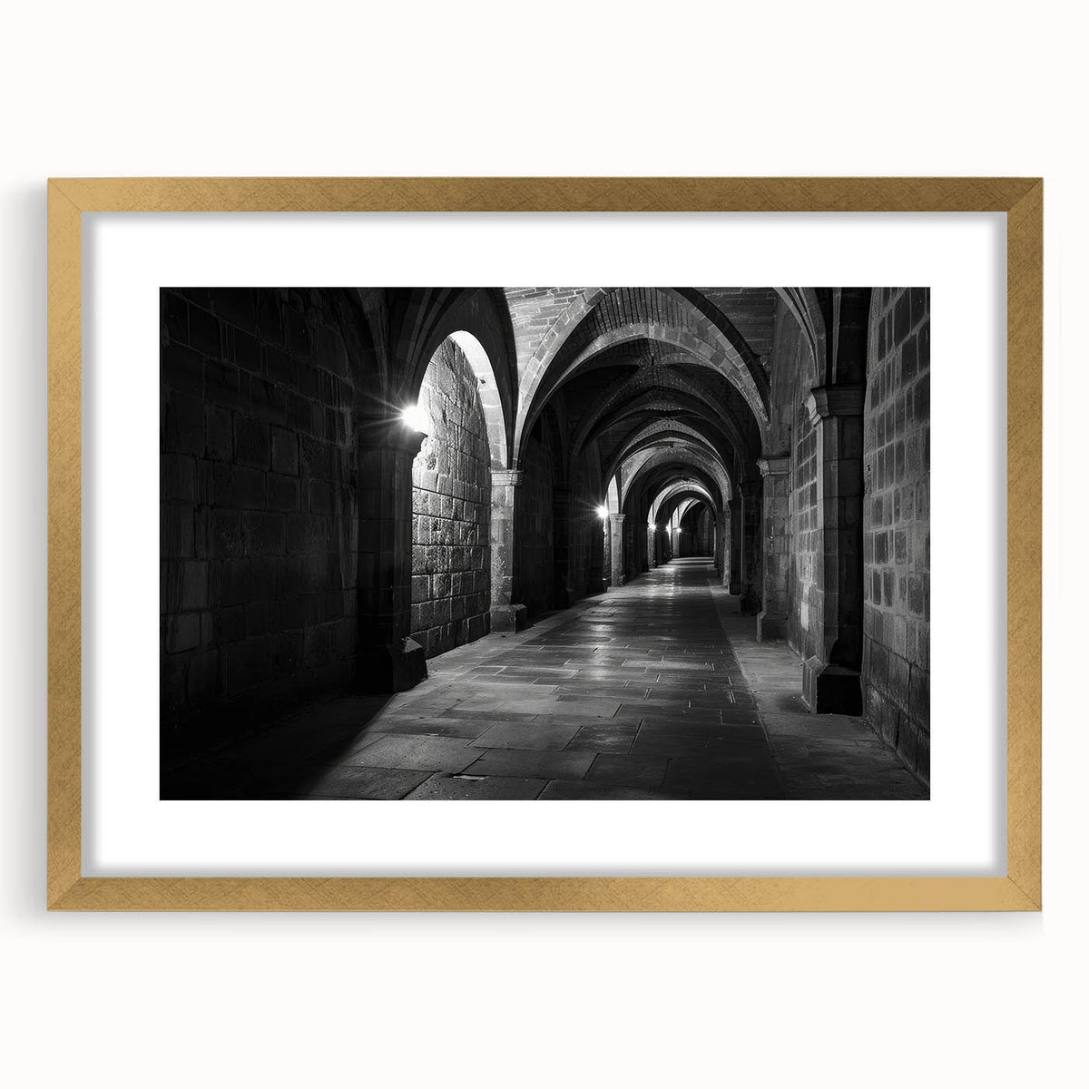 Abstract art print featuring symmetrical arch designs in muted gold and white tones on a framed canvas.