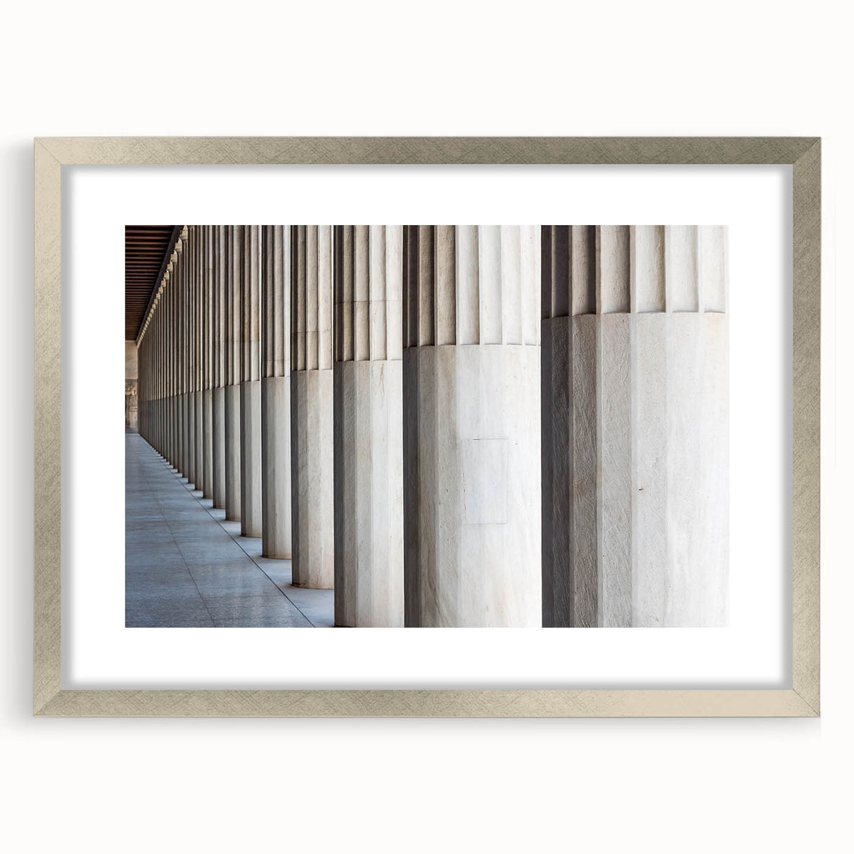 Textured art print of abstract columns in muted gray, framed in silver, ideal for modern bedroom ambiance.