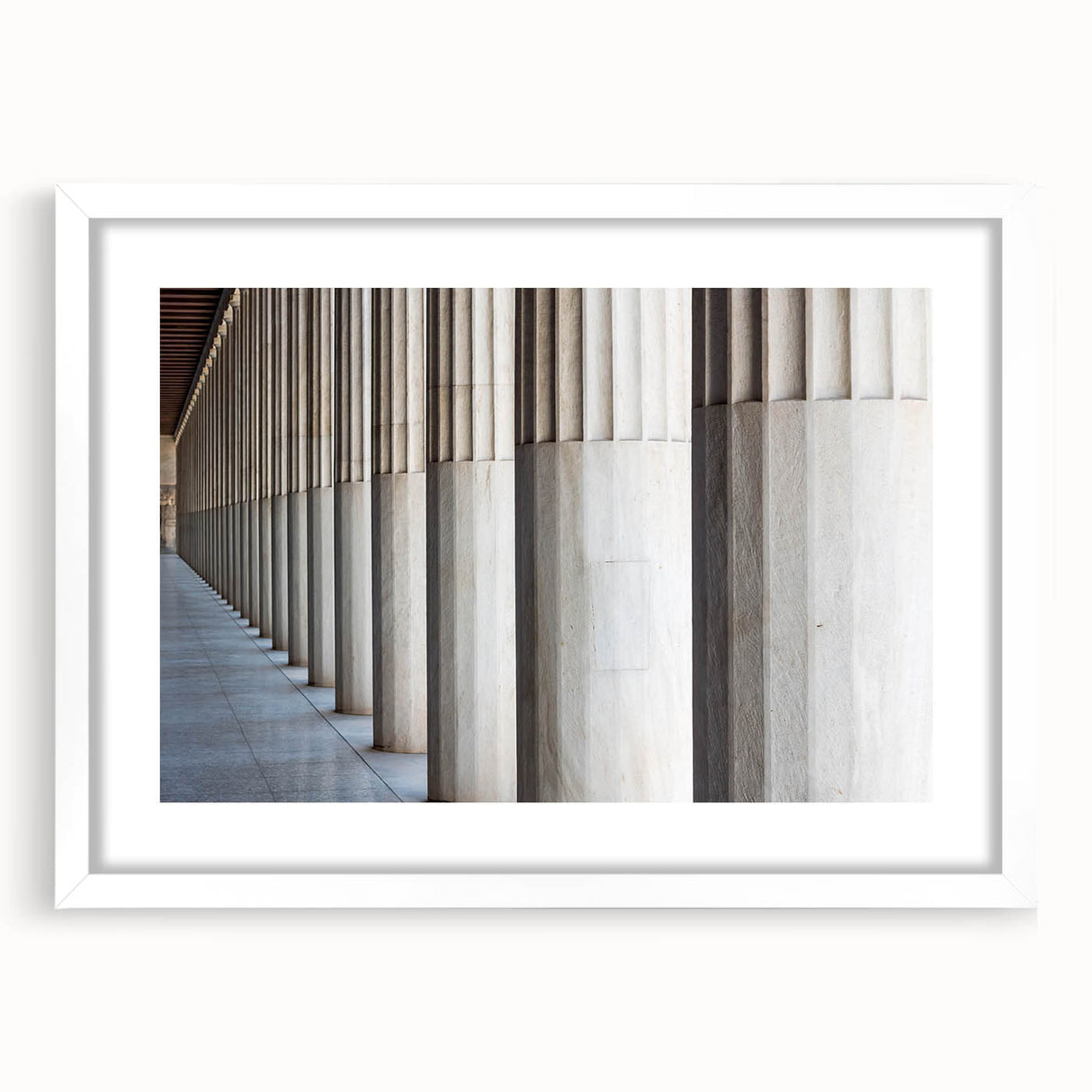 Abstract art print featuring a series of white columns in various geometric patterns on a framed poster.