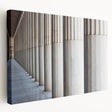 Side view of a large art print on canvas depicting classical architectural columns in monochrome.