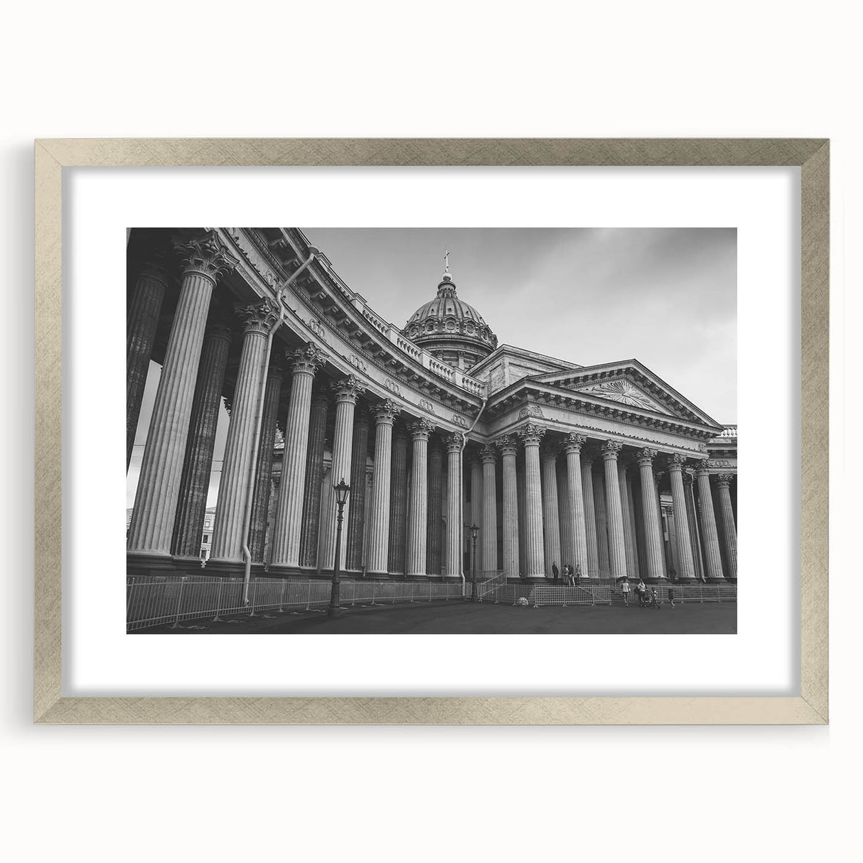 Abstract art print featuring geometric column designs in muted gray, framed in silver, ideal for dining room decor.