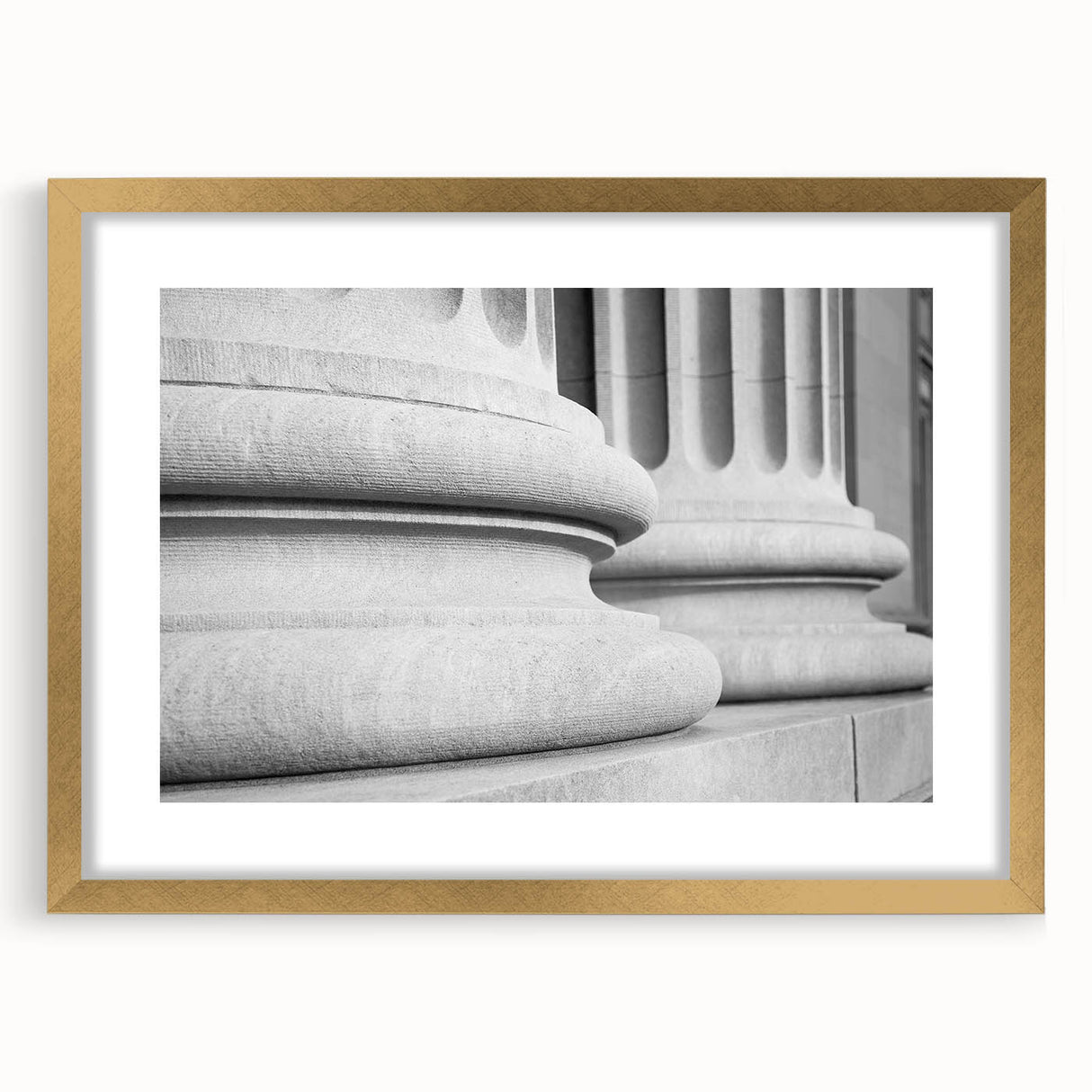 Extra large abstract art print featuring textured columns in muted gold and white tones, framed with a gold mat.