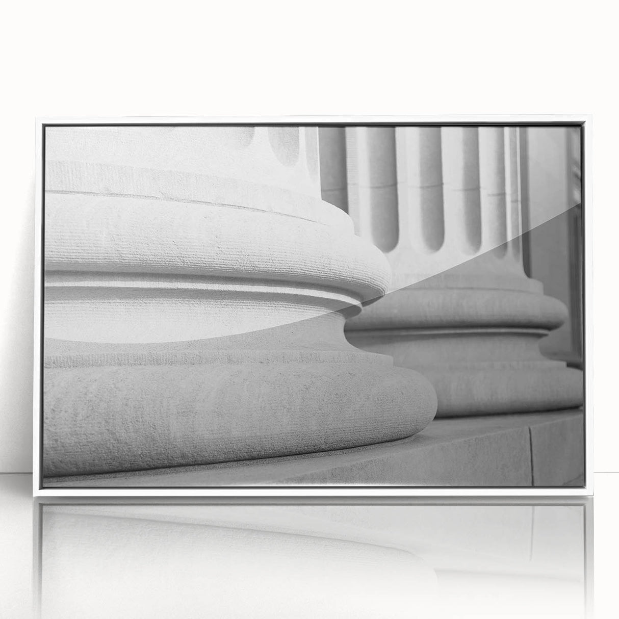 Framed acrylic print of art deco architecture columns in black and white, ideal for modern art wall decor in a nursery.
