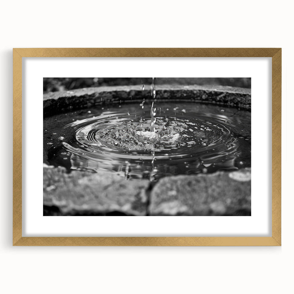 Extra large abstract art print of a textured fountain design in gold tones, framed with mat, ideal for living room decor.