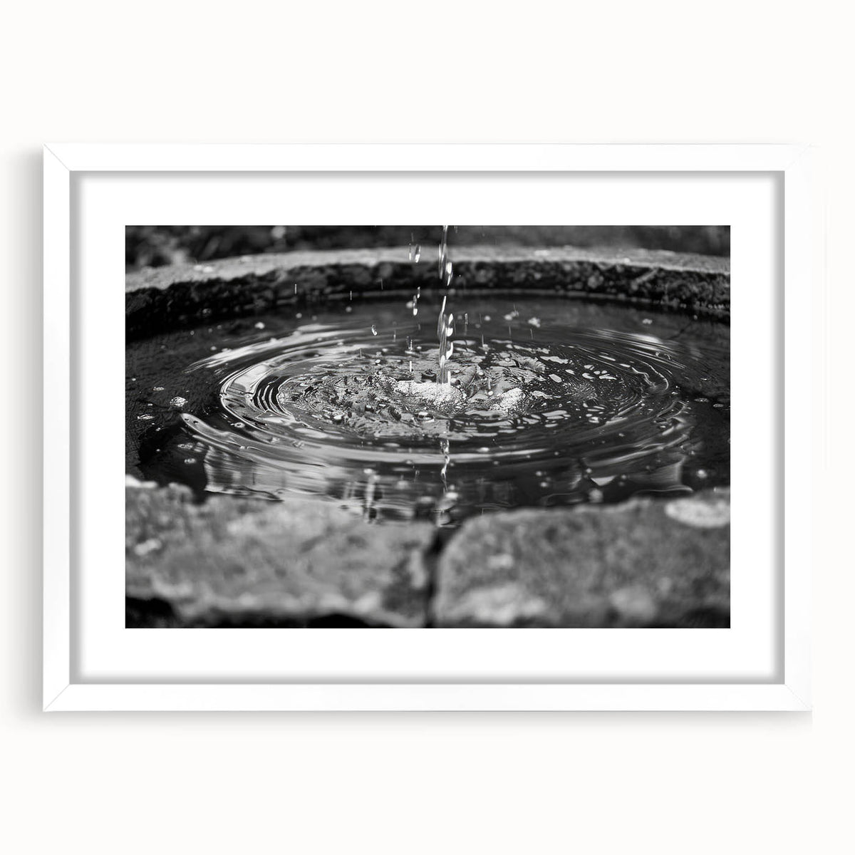 Abstract art print featuring a monochrome architectural fountain design on a white framed matte, ideal for dining room decor.