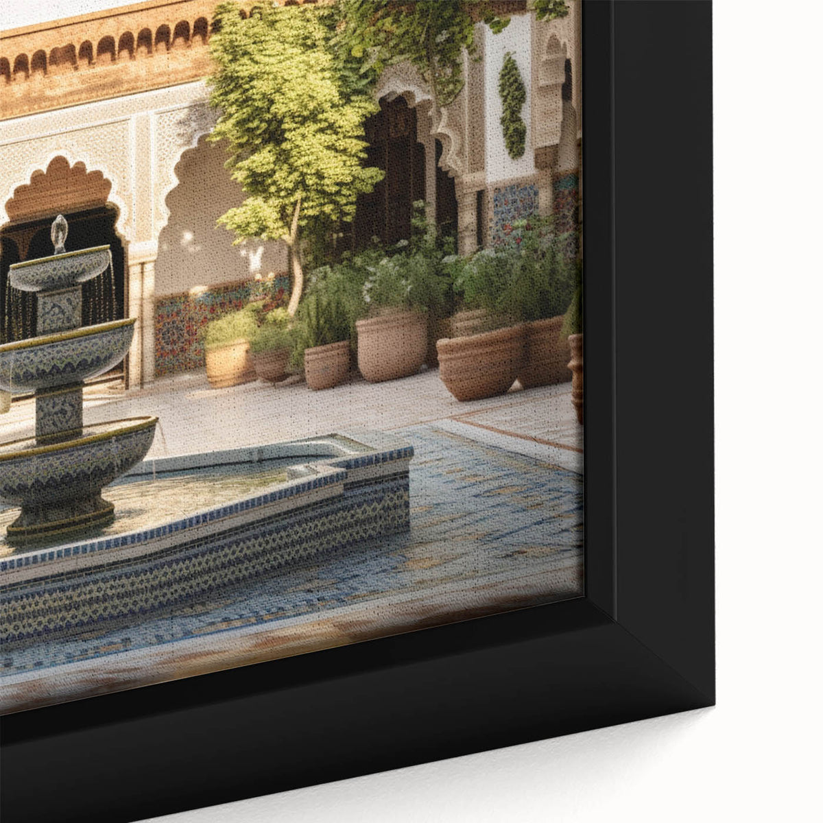 Close-up of black wall art featuring a textured fountain design in vibrant colors on a framed canvas.