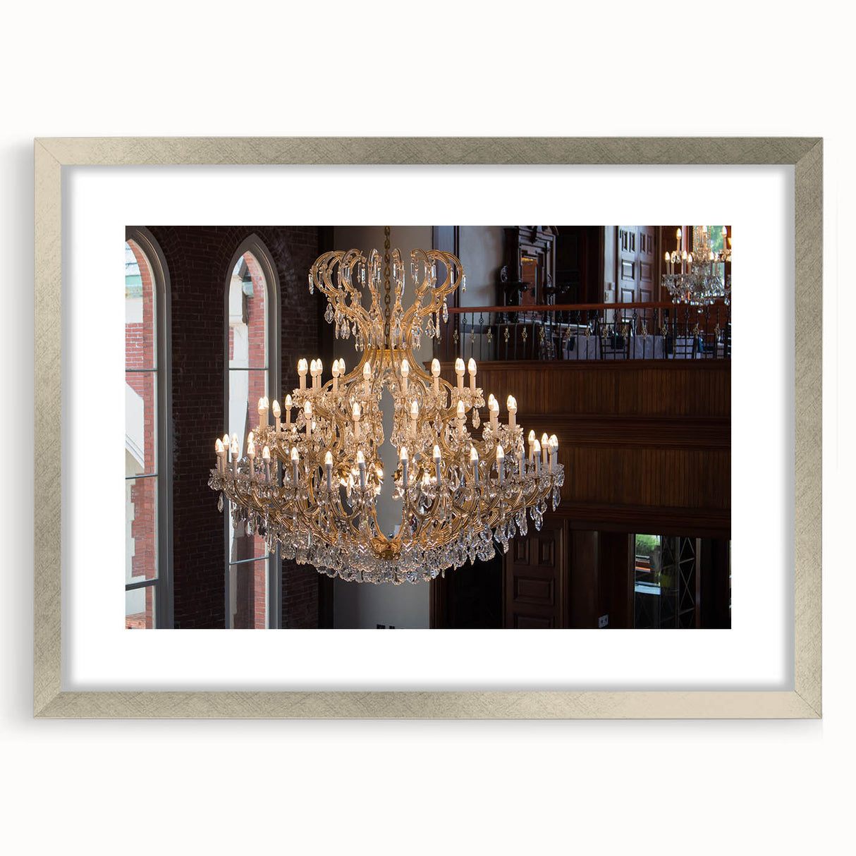 Abstract art print featuring geometric shapes in silver and gray tones on a framed canvas.