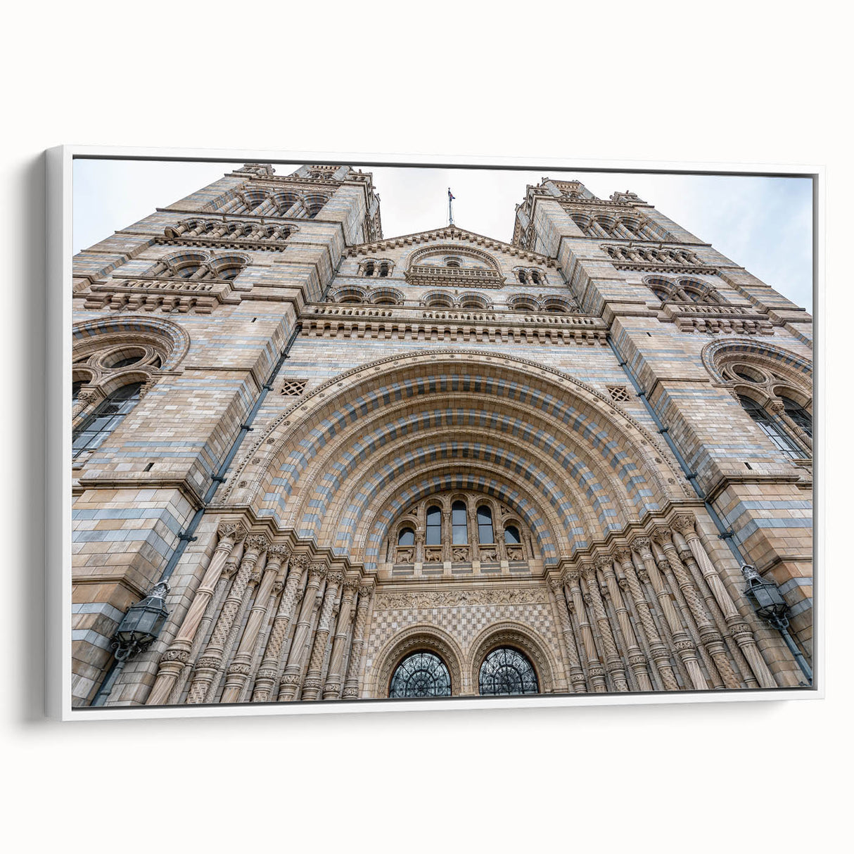 Framed canvas featuring a vintage-style landscape painting with predominant black and muted tones.