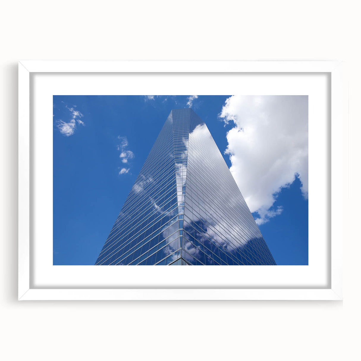 Extra large abstract art print featuring textured skyscraper design in muted gray, framed with a white mat.