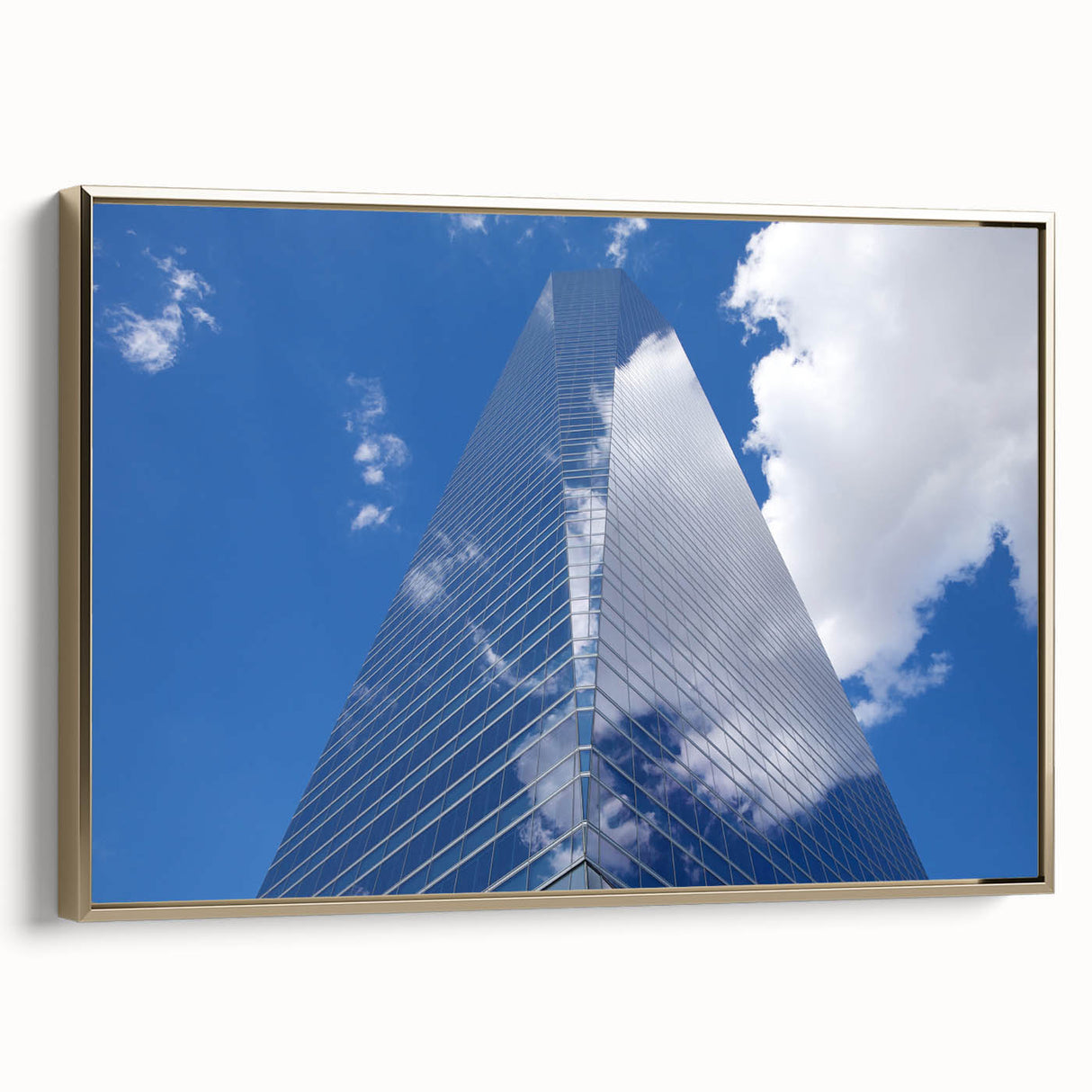 Framed canvas of a vintage skyscraper landscape in muted gold and black tones, ideal for office decor.