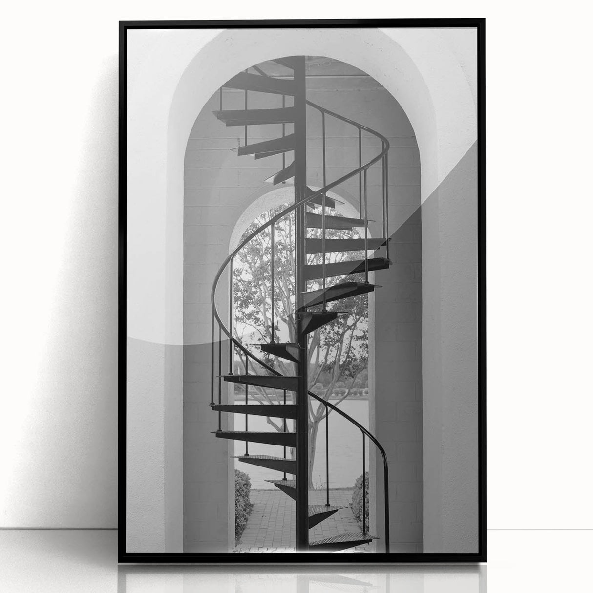 Large abstract wall art featuring a spiral staircase in black and white, framed in acrylic, suitable for modern decor.