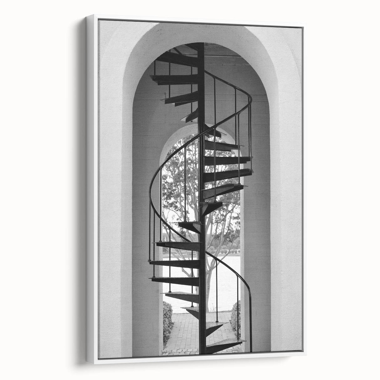 Framed canvas of a vintage poster art featuring a spiral staircase in black and white, ideal for living room decor.