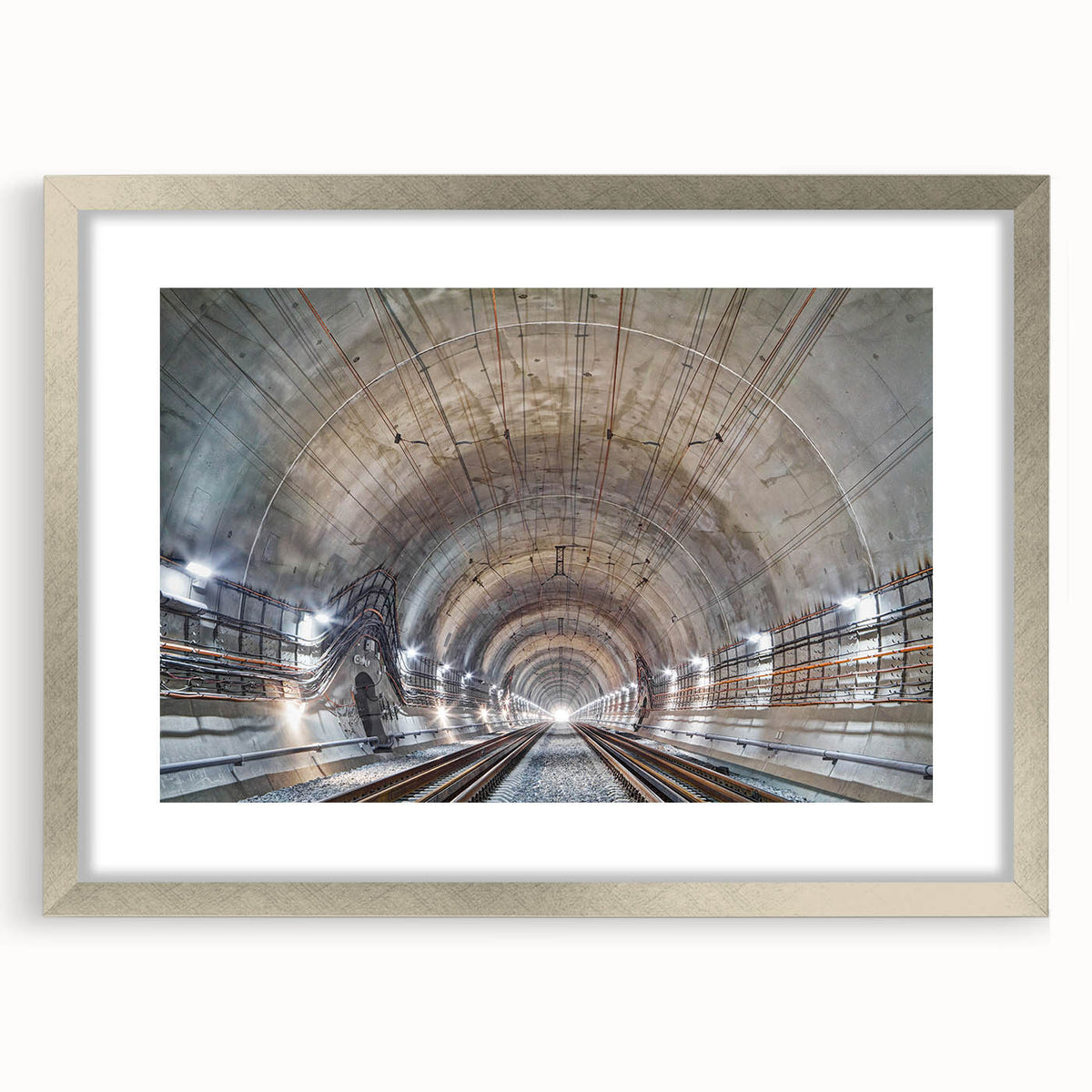 Textured abstract art print featuring curvilinear shapes in muted gray, framed in silver, ideal for bedroom art.