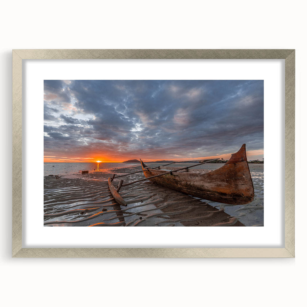 Abstract art print of a Madagascar scenery in muted earth tones, framed in silver, ideal for dining room decor.