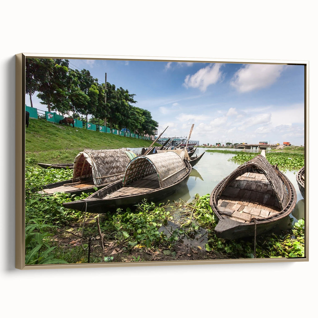 Framed canvas featuring a vintage-style landscape painting of rural Bangladesh in muted gold and black tones.