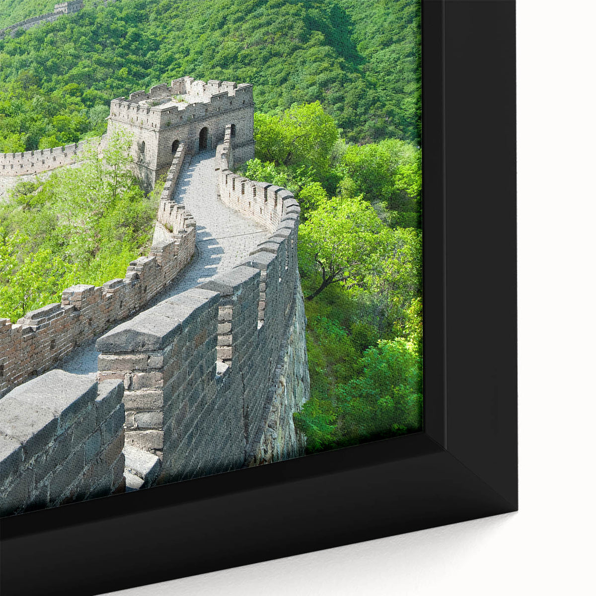 Close-up of extra large black wall art featuring a textured depiction of the Great Wall of China on framed canvas.