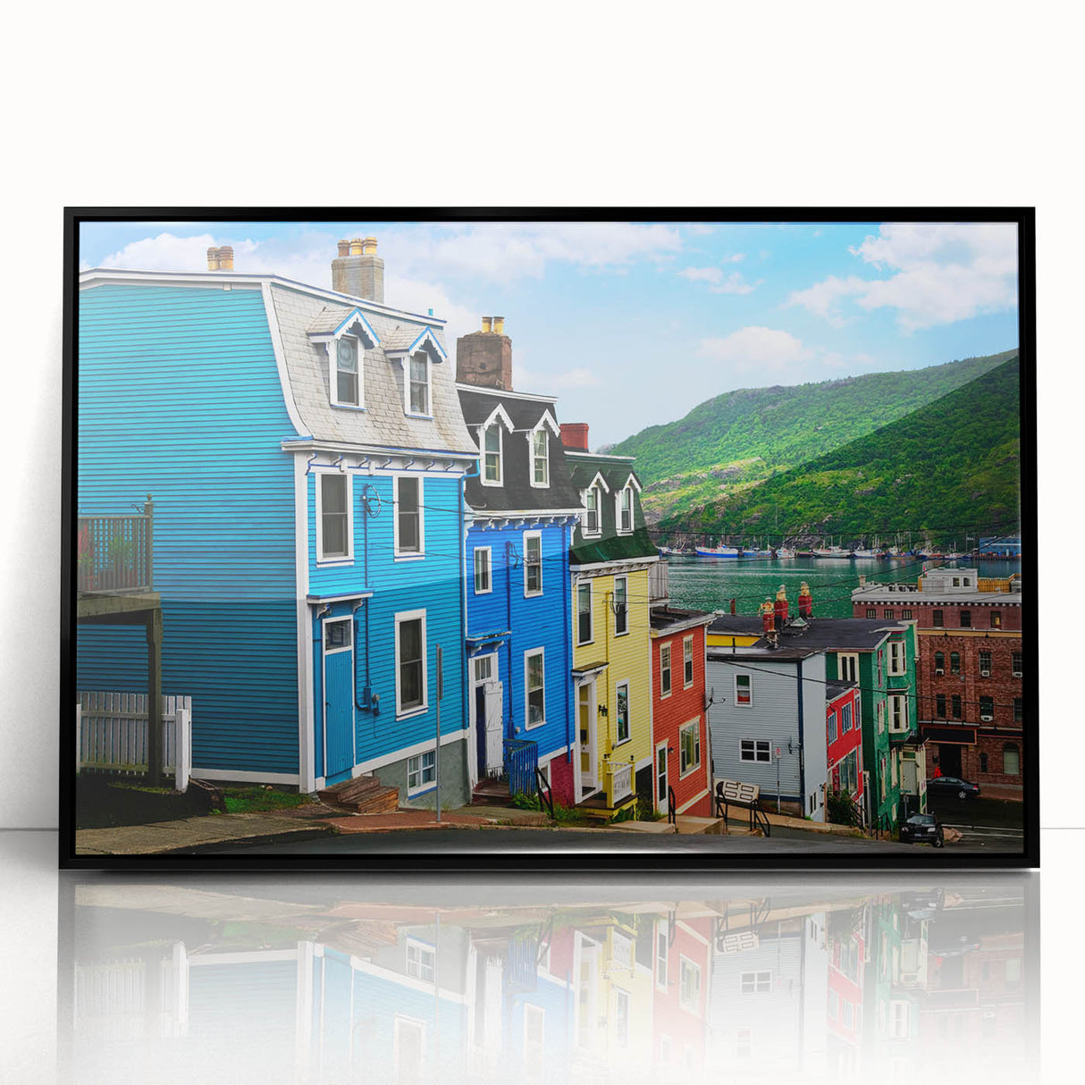 Large abstract wall art depicting a stylized Newfoundland scenery in muted gray and green tones, framed in black acrylic.