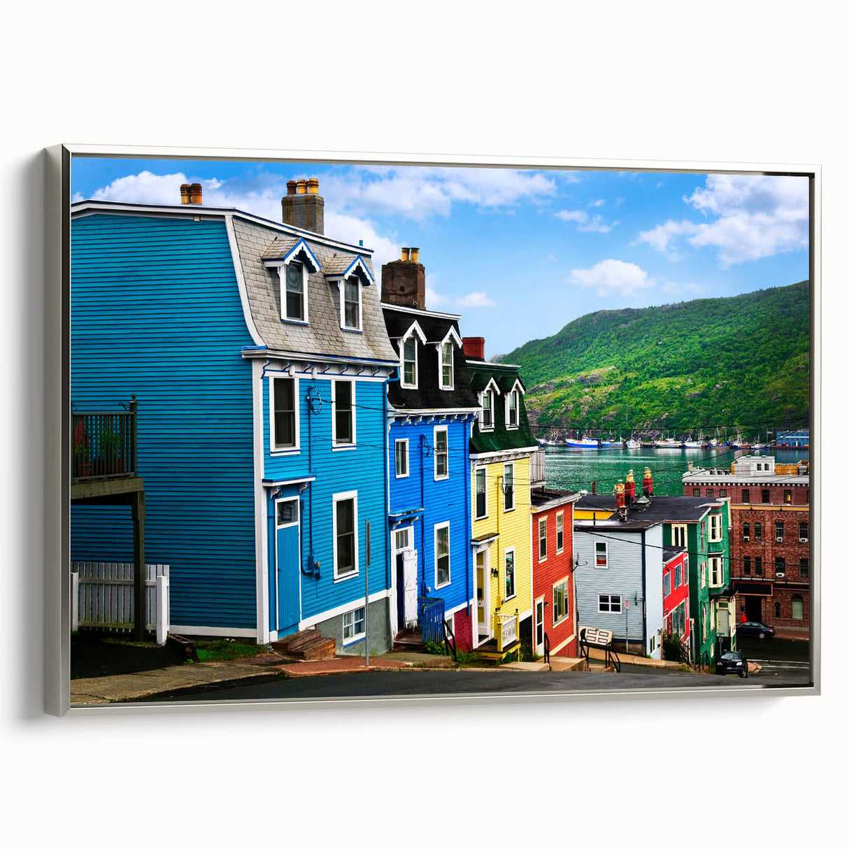Framed canvas depicting a vintage-style Newfoundland landscape in colorful hues, ideal for living room decor.