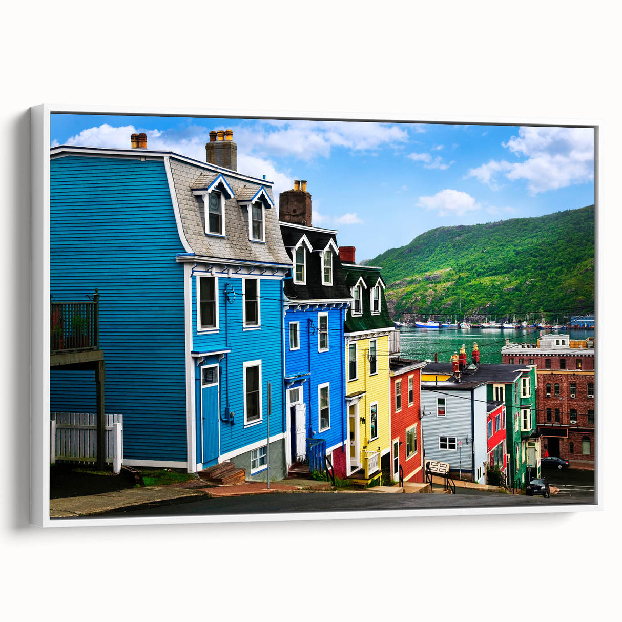 Vintage poster art of Newfoundland scenery on an extra large framed canvas, with colorful imagery against a black background.