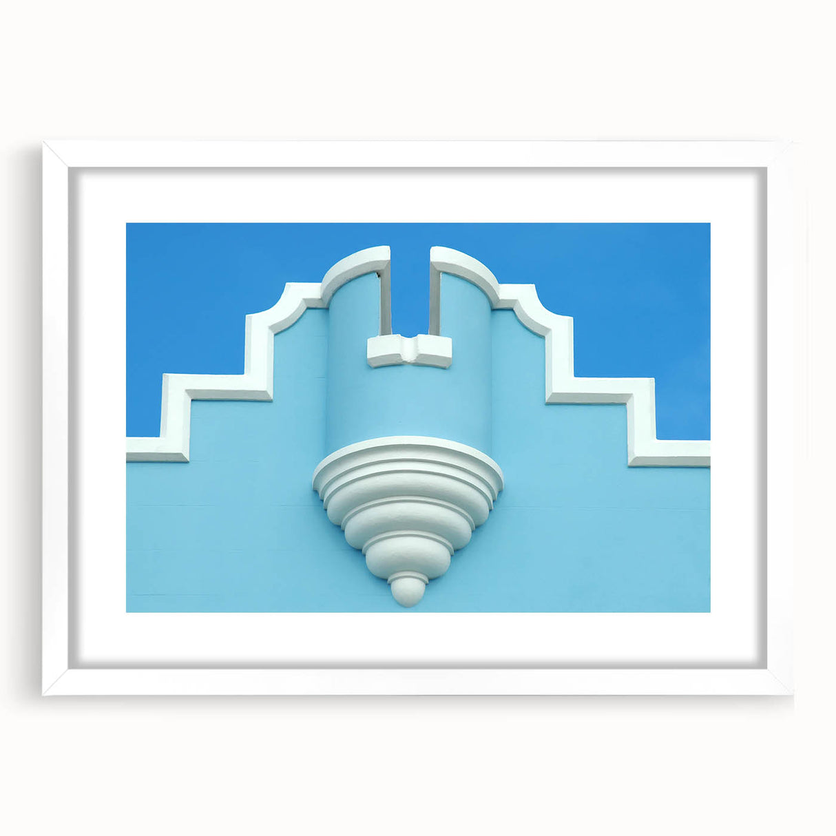 Textured abstract art print of Caribbean scenery in muted blue and green shades on a framed white mat.