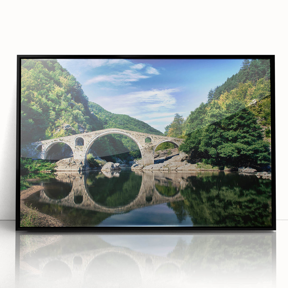 Large abstract wall art depicting a European landscape in muted gray and blue tones, framed in black acrylic.