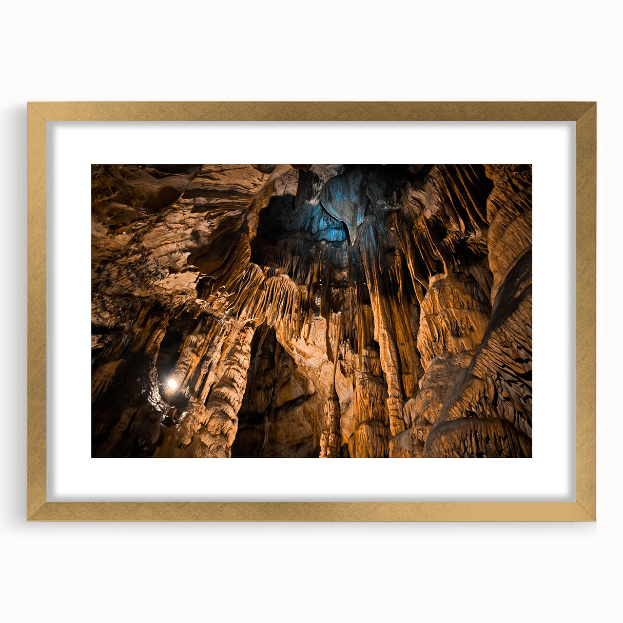 Abstract art print of a European scenery in muted earth tones, framed in gold, suitable for dining room decor.