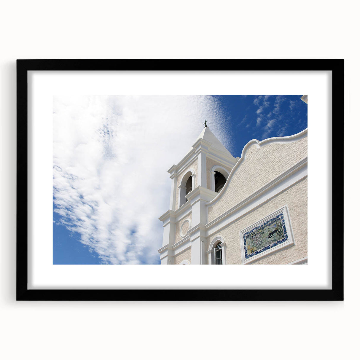 Abstract art print of Cabo San Lucas with vibrant, colorful textures on a framed black mat, ideal for living room decor.