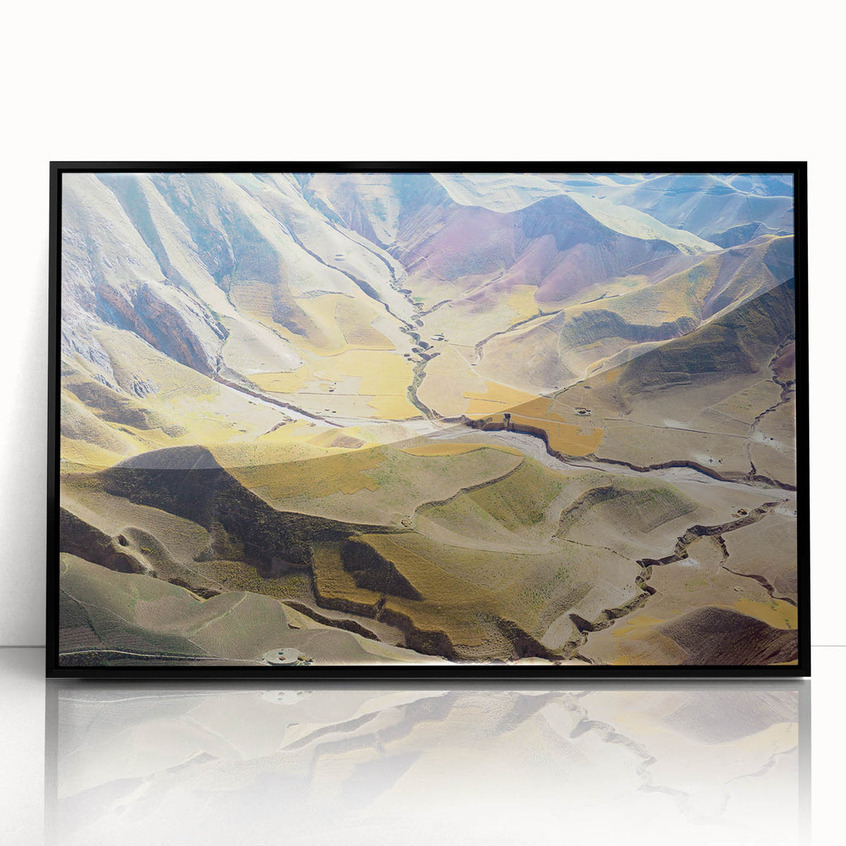 Large abstract wall art depicting a Middle Eastern scenery in muted earth tones on a framed acrylic.
