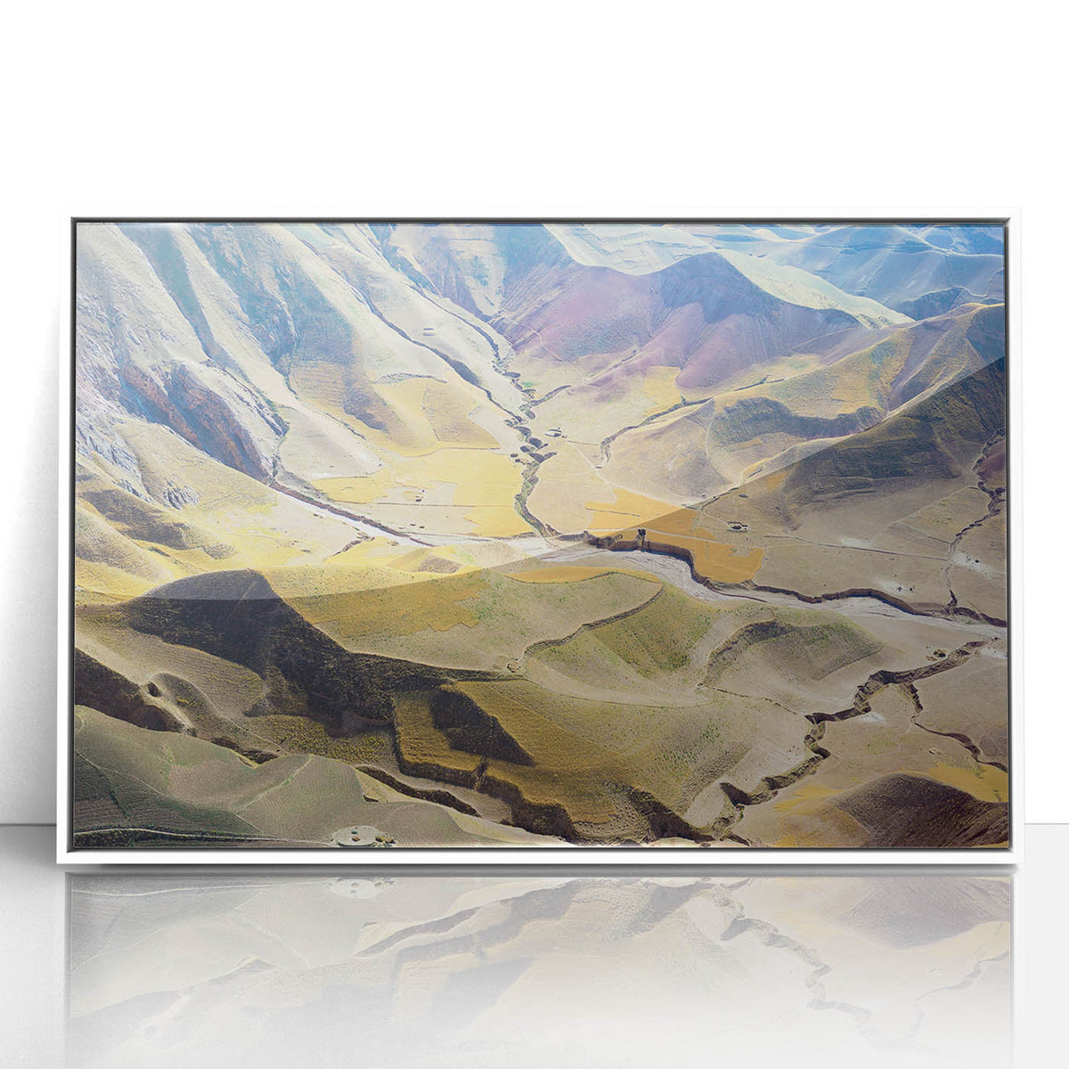 Acrylic print of a Middle Eastern desert scene in muted earth tones, framed in white, suitable for modern art wall decor.