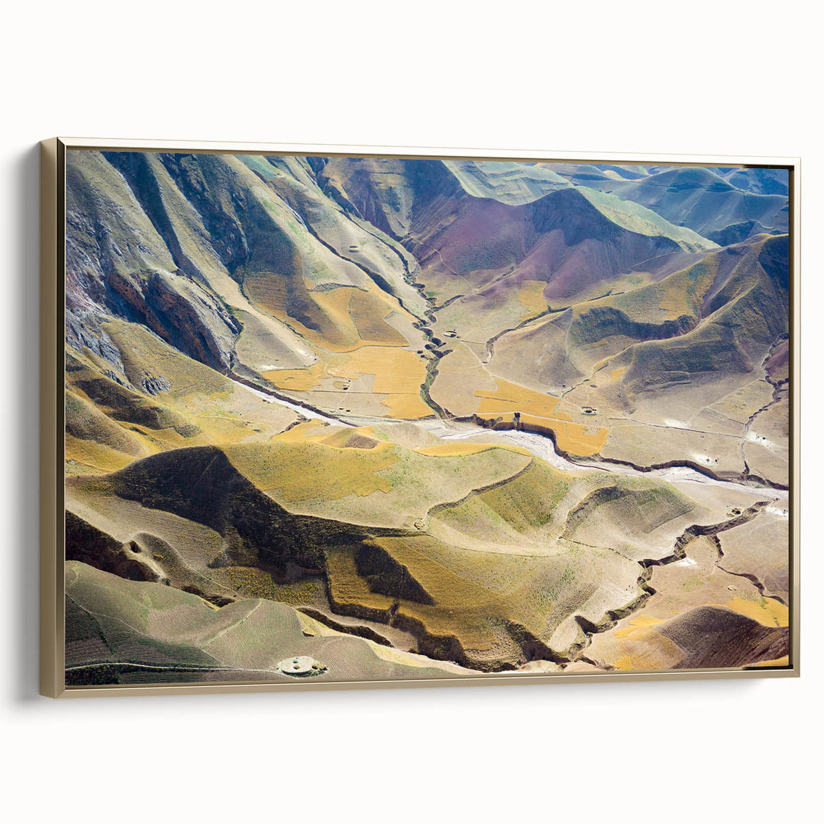Framed canvas wall art featuring a vintage-style landscape of Middle Eastern scenery, in gold and black tones.