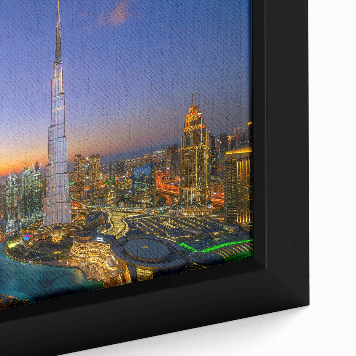 Close-up of a textured black wall art featuring the Burj Khalifa in vibrant colors on a framed canvas.