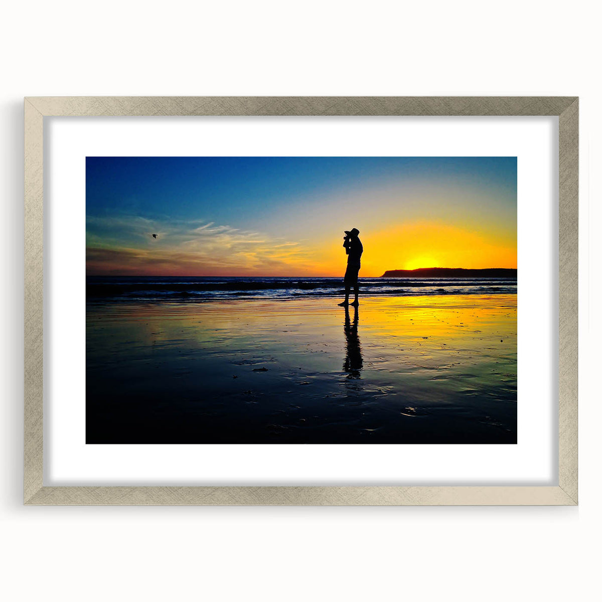 Textured abstract art print of California scenery in muted earth tones on a framed silver mat, suitable for bedroom decor.
