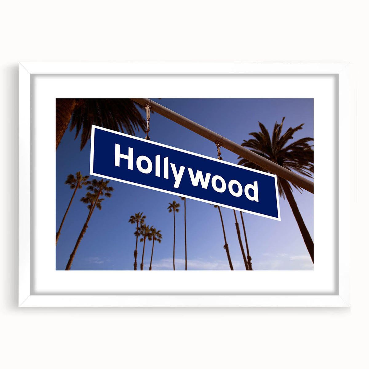 Abstract art print of Hollywood, California in muted gray and blue tones on a framed white mat, ideal for dining room decor.