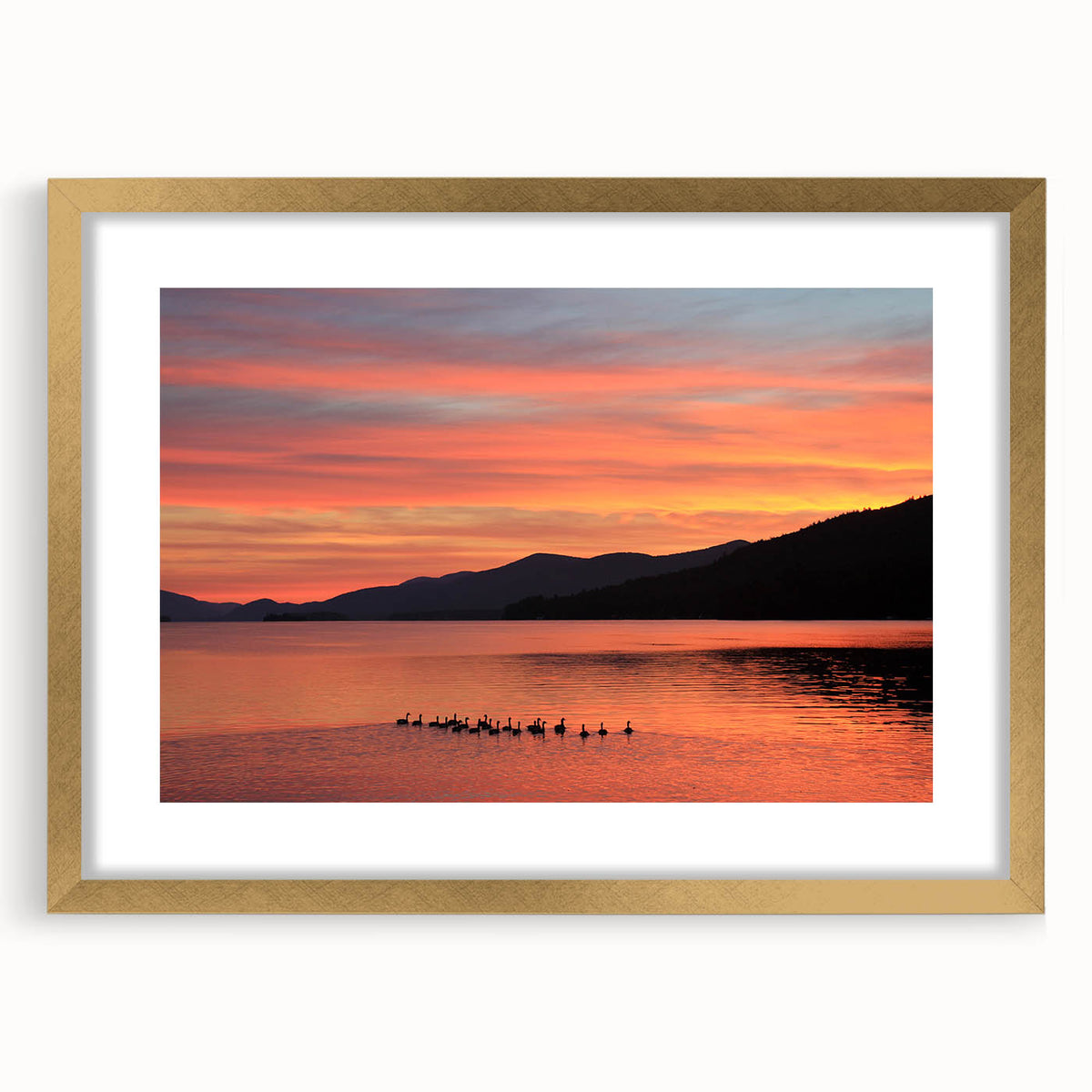 Extra large wall art featuring an abstract depiction of the Adirondacks in textured hues of blue and green, framed in gold.