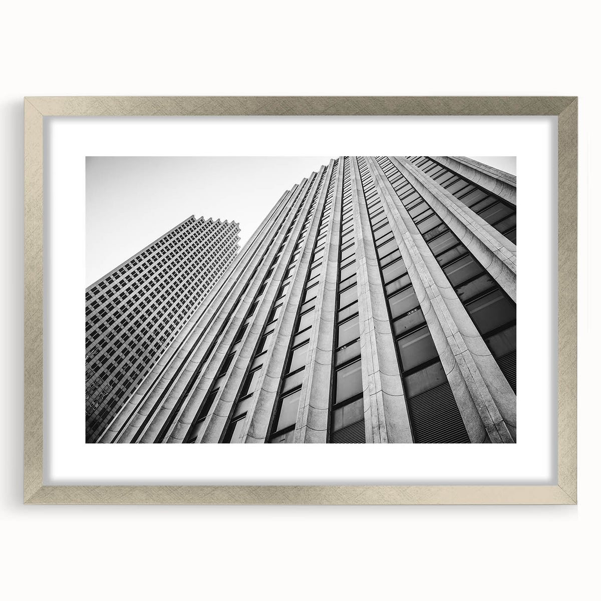 Textured abstract art print of the Houston skyline, in muted gray tones on a framed canvas, ideal for bedroom wall decor.