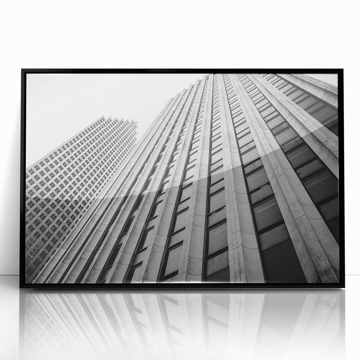 Large abstract wall art depicting Houston skyline in muted gray and black tones on a framed acrylic.